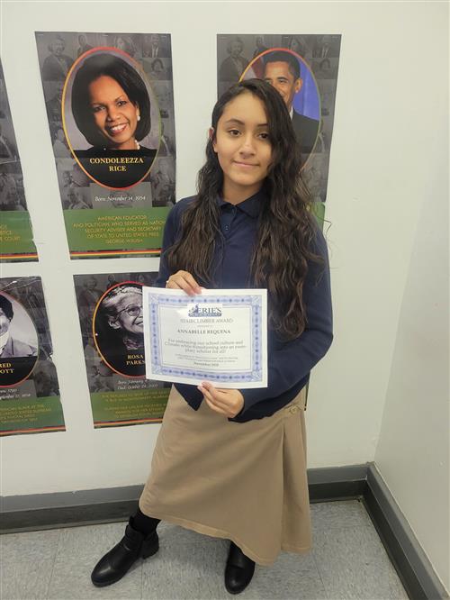Annabelle Requena, Eagle Nest's Stairclimber for November, poses with her award plaque.